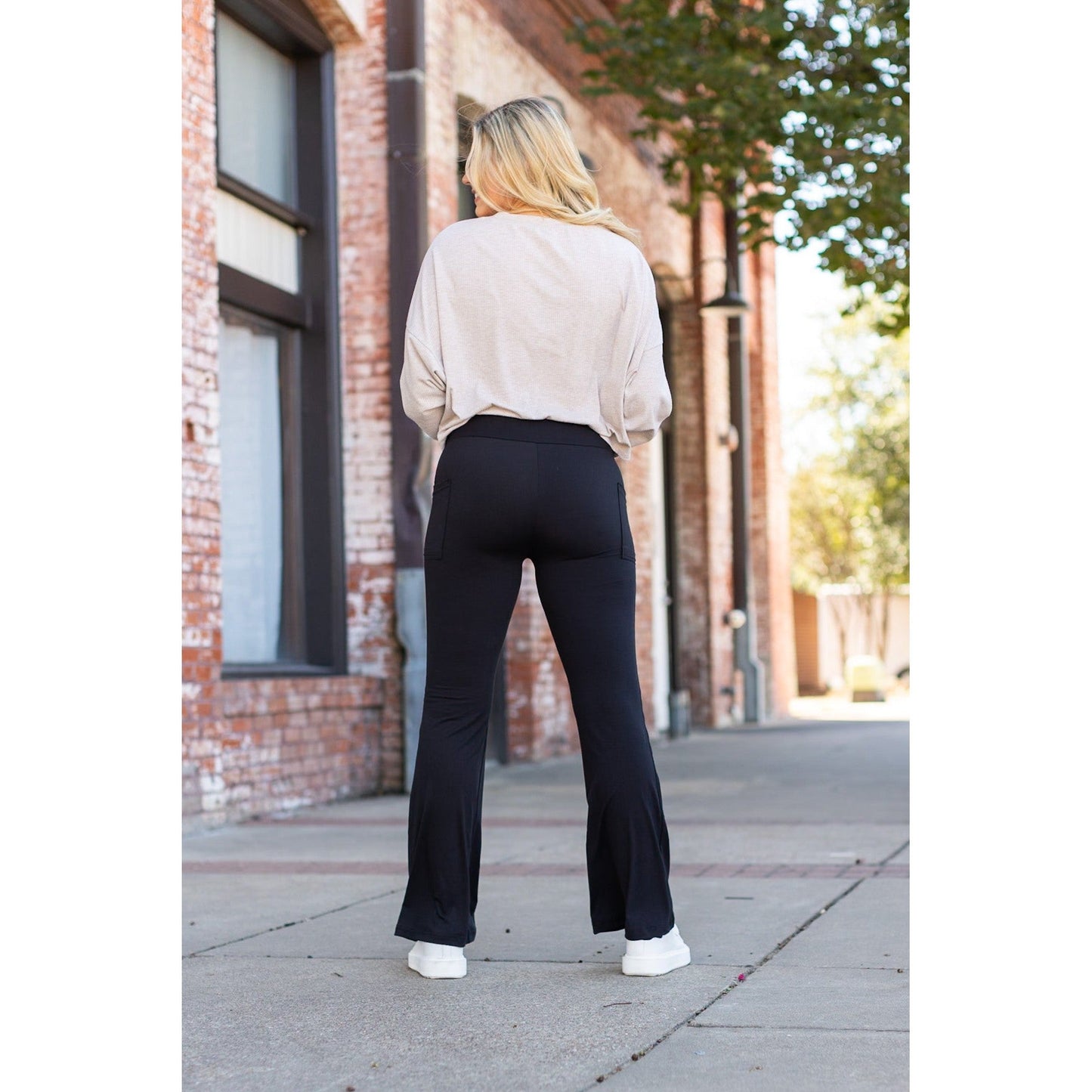 High-waisted black bootcut leggings by Julia Rose, Julia Rose women’s flared black leggings lifestyle image