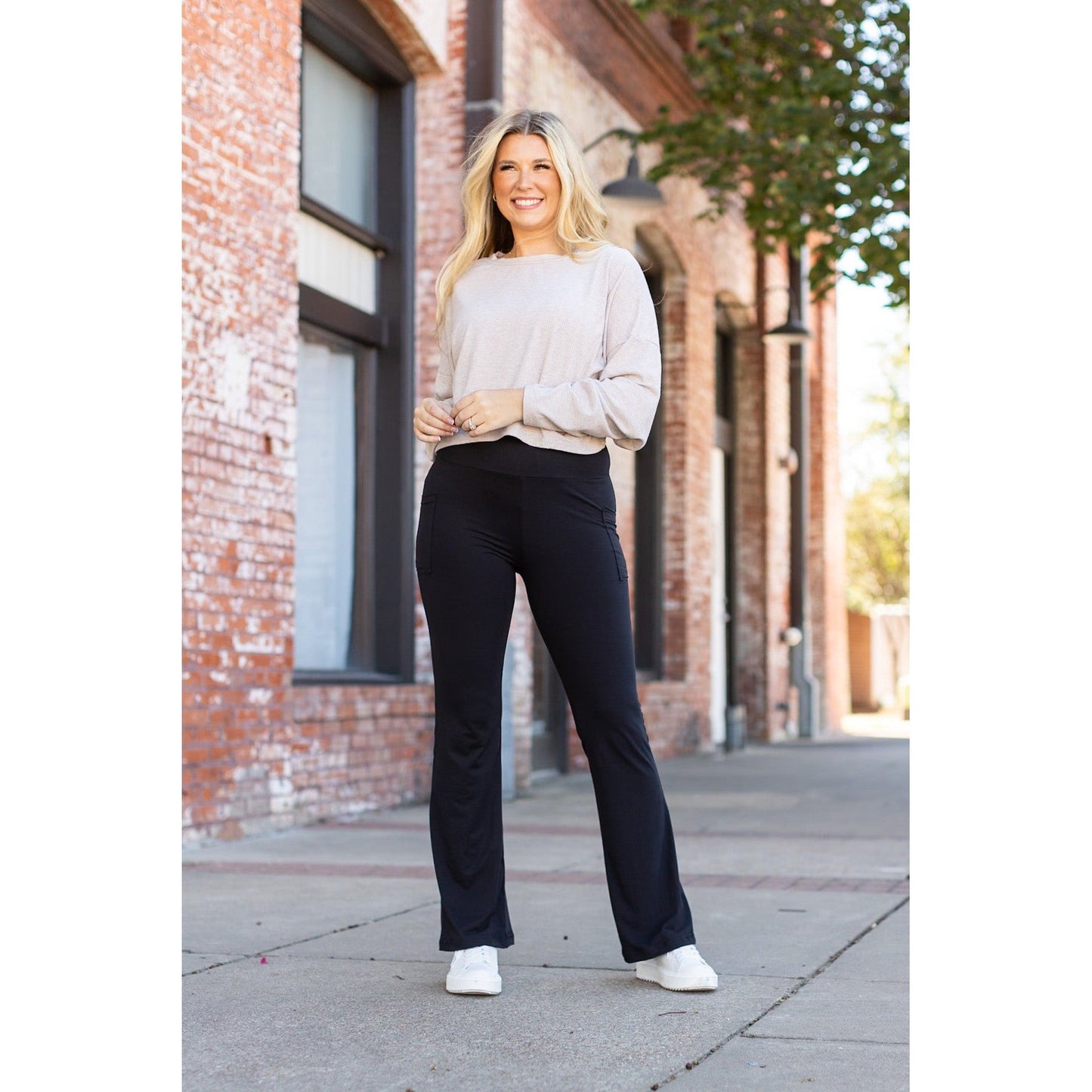 High-waisted black bootcut leggings by Julia Rose, Julia Rose women’s flared black leggings lifestyle image