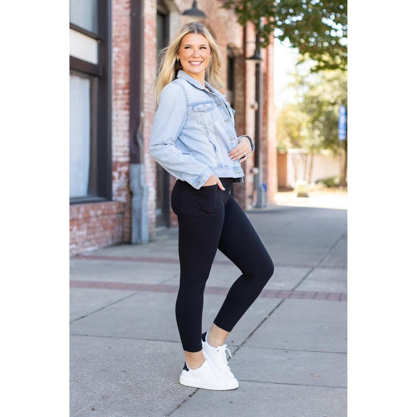 High-waisted black ankle length leggings with pockets by Julia Rose, Julia Rose women’s black 7/8 leggings lifestyle image