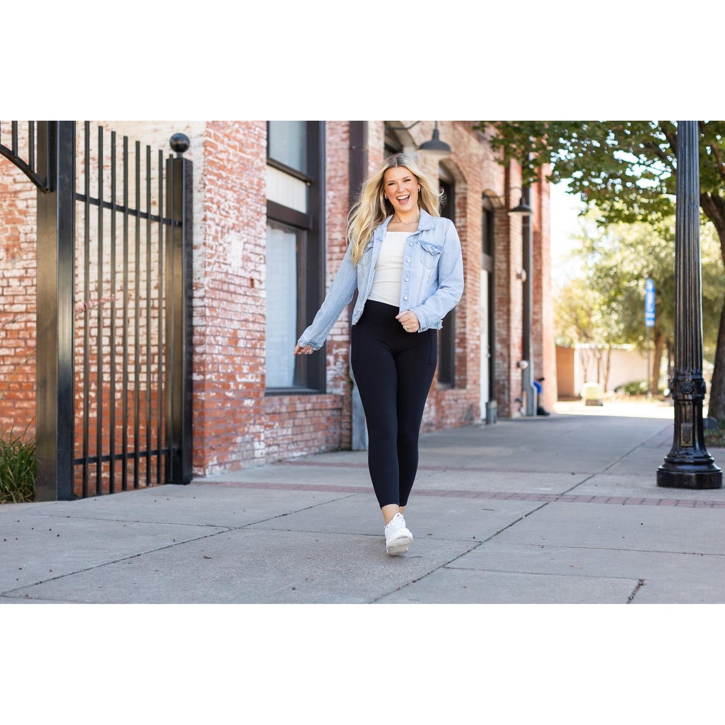 High-waisted black ankle length leggings with pockets by Julia Rose, Julia Rose women’s black 7/8 leggings lifestyle image
