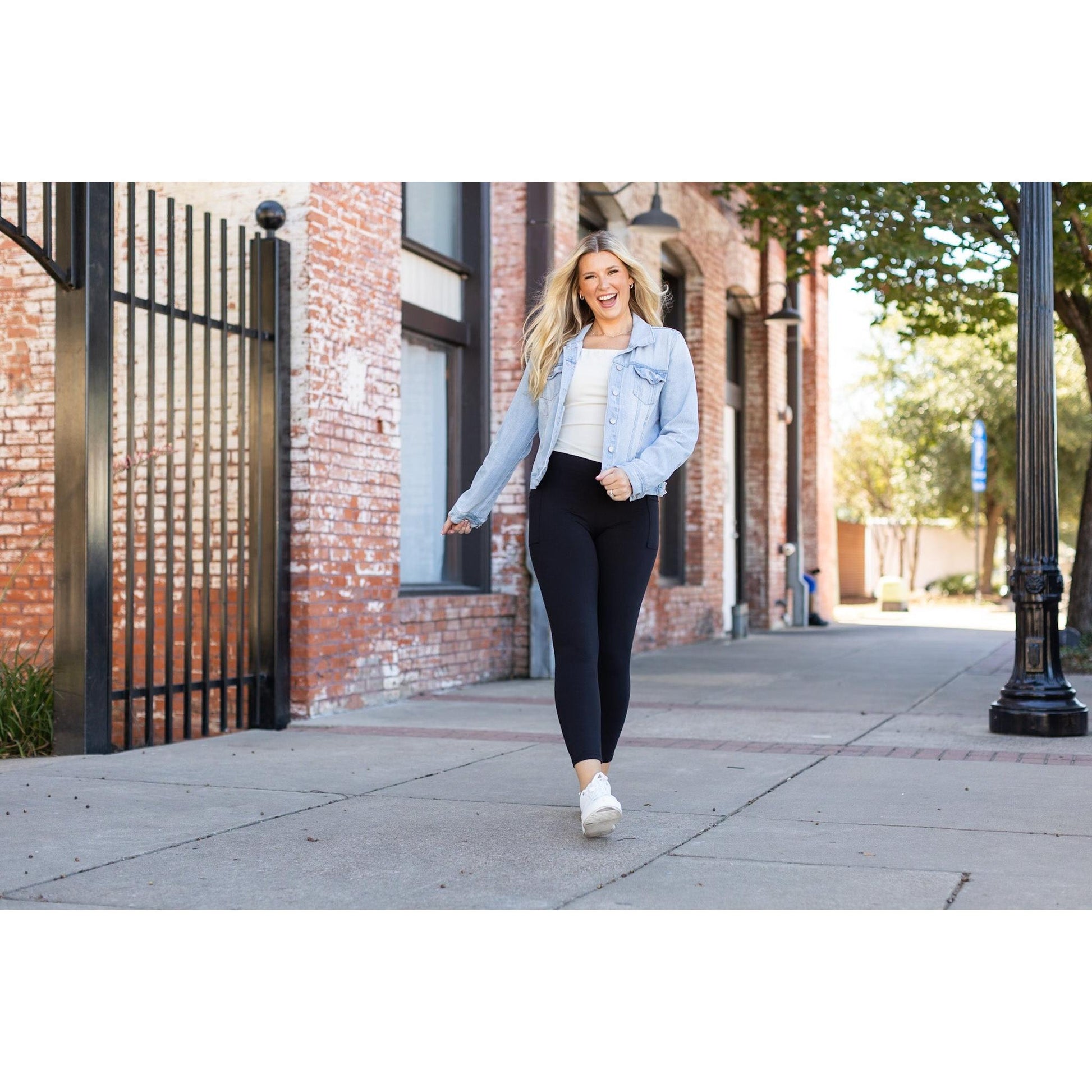 High-waisted black ankle length leggings with pockets by Julia Rose, Julia Rose women’s black 7/8 leggings lifestyle image