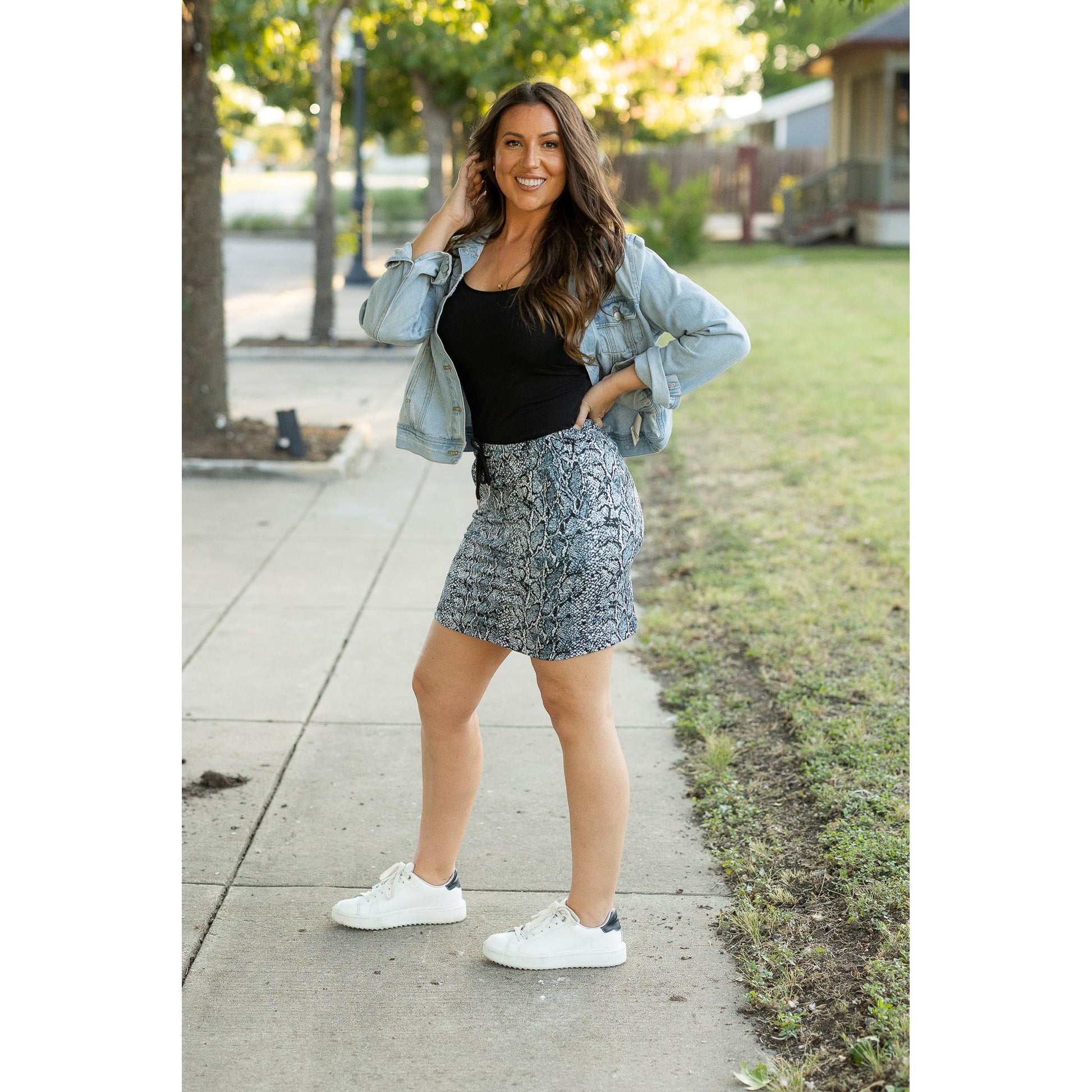 Julia Rose Sydney Snakeskin Jogger Skirt women’s boutique midi skirt front view, Woman wearing Julia Rose Sydney jogger style snakeskin skirt
