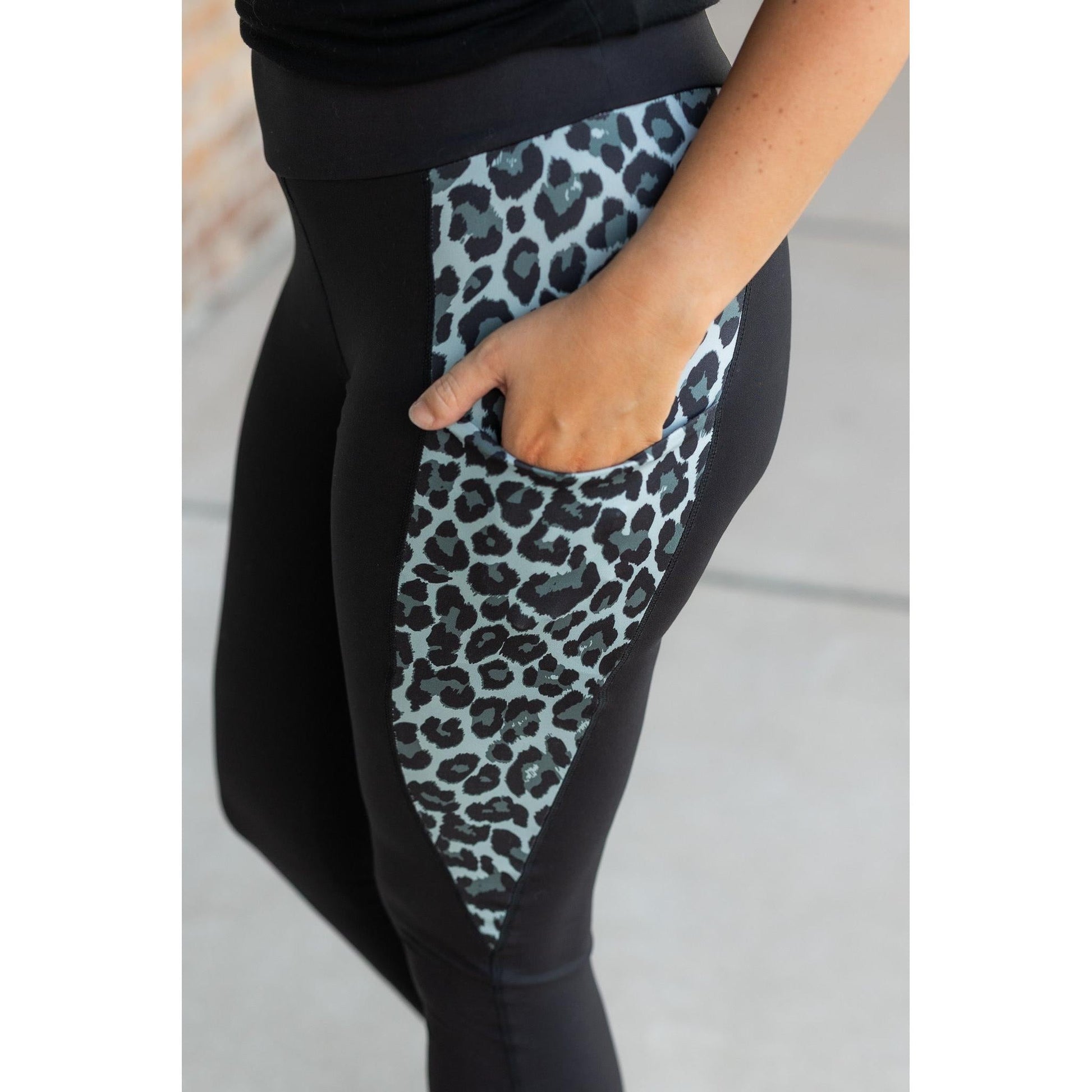 Snow leopard panel detail on  Buttery soft leopard panel leggings for women by Julia Rose