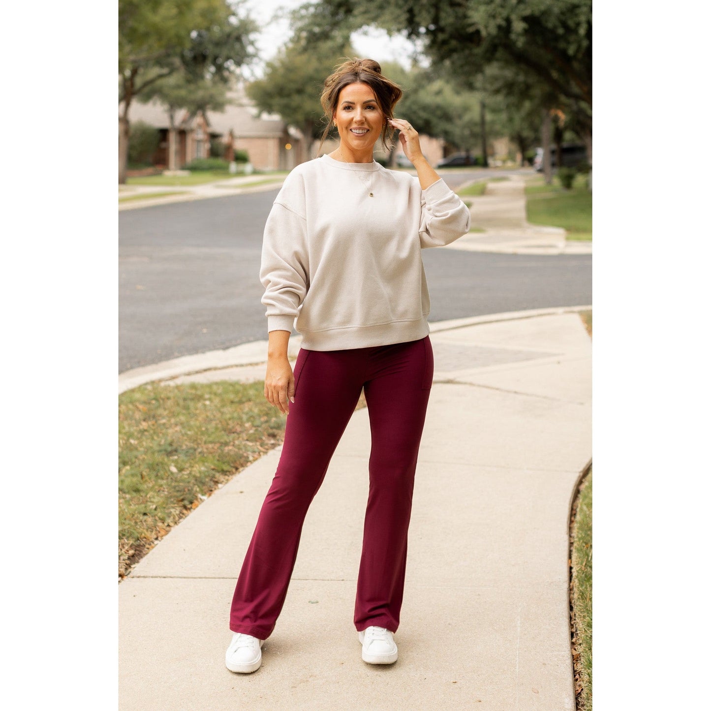 High-waisted maroon bootcut leggings with pockets by Julia Rose, Julia Rose women’s maroon flared leggings lifestyle image