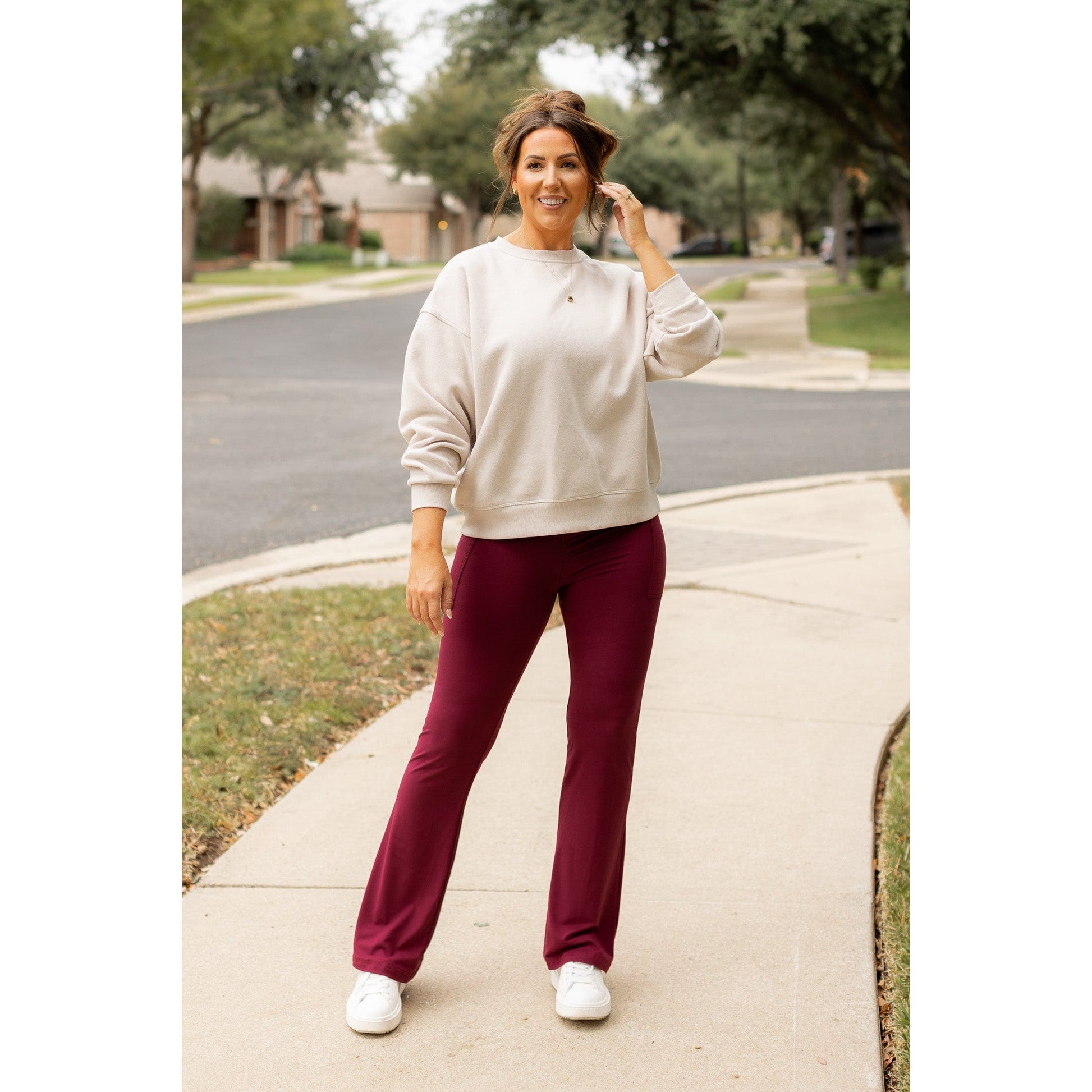 High-waisted maroon bootcut leggings with pockets by Julia Rose, Julia Rose women’s maroon flared leggings lifestyle image