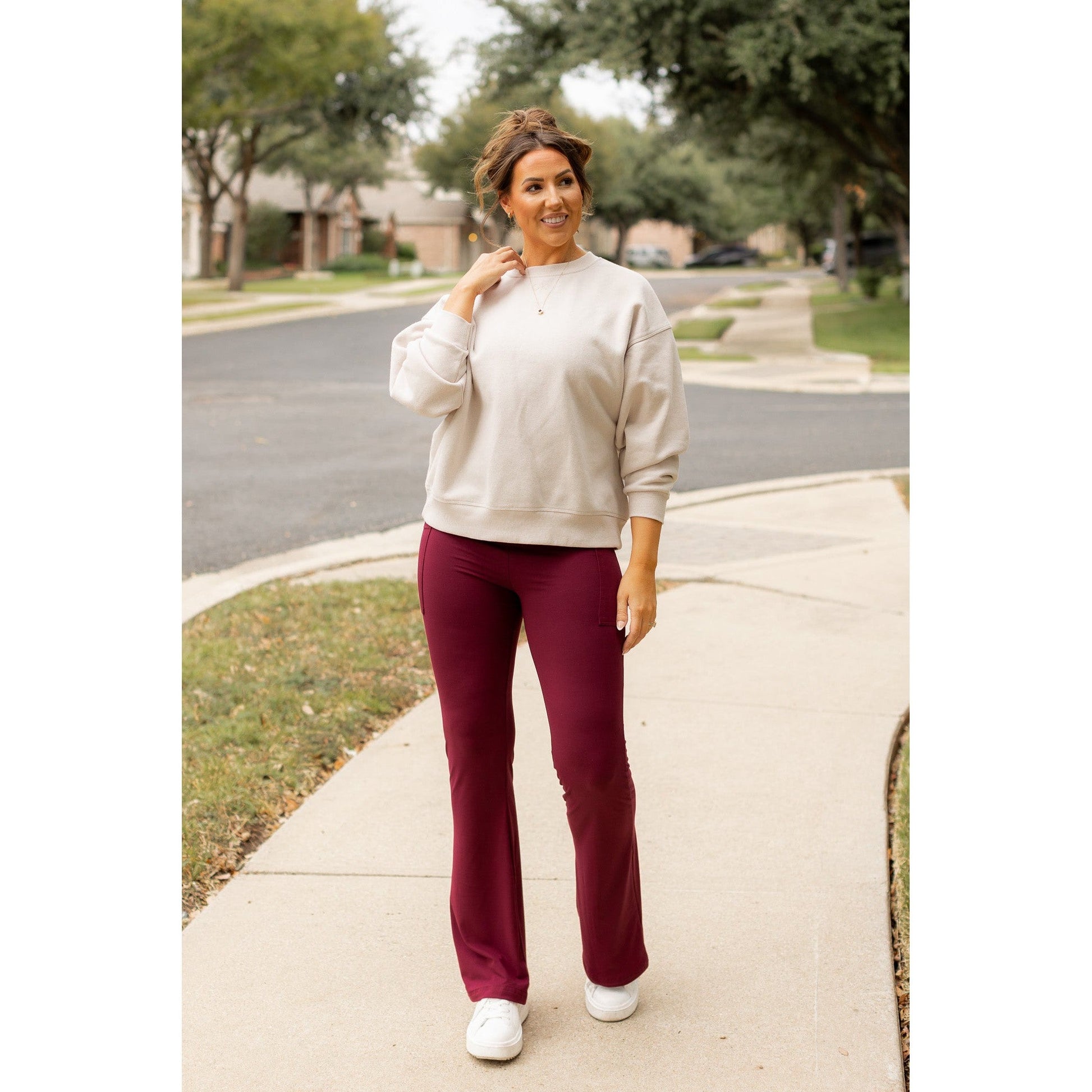 High-waisted maroon bootcut leggings with pockets by Julia Rose, Julia Rose women’s maroon flared leggings lifestyle image