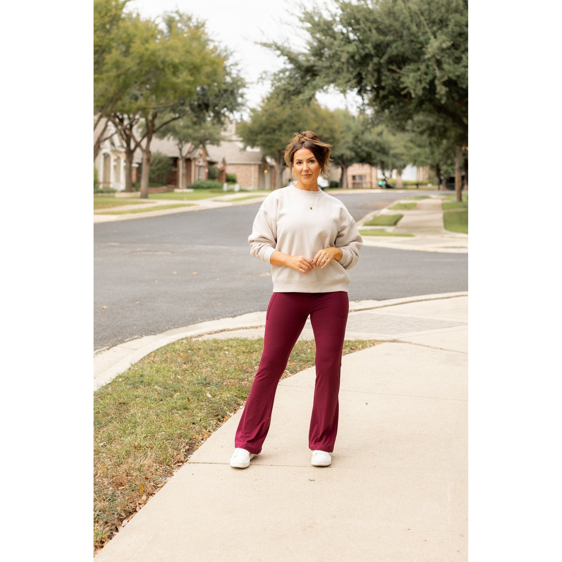 High-waisted maroon bootcut leggings with pockets by Julia Rose, Julia Rose women’s maroon flared leggings lifestyle image