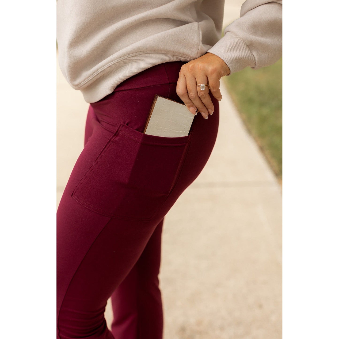 High-waisted maroon bootcut leggings with pockets by Julia Rose, Julia Rose women’s maroon flared leggings lifestyle image
