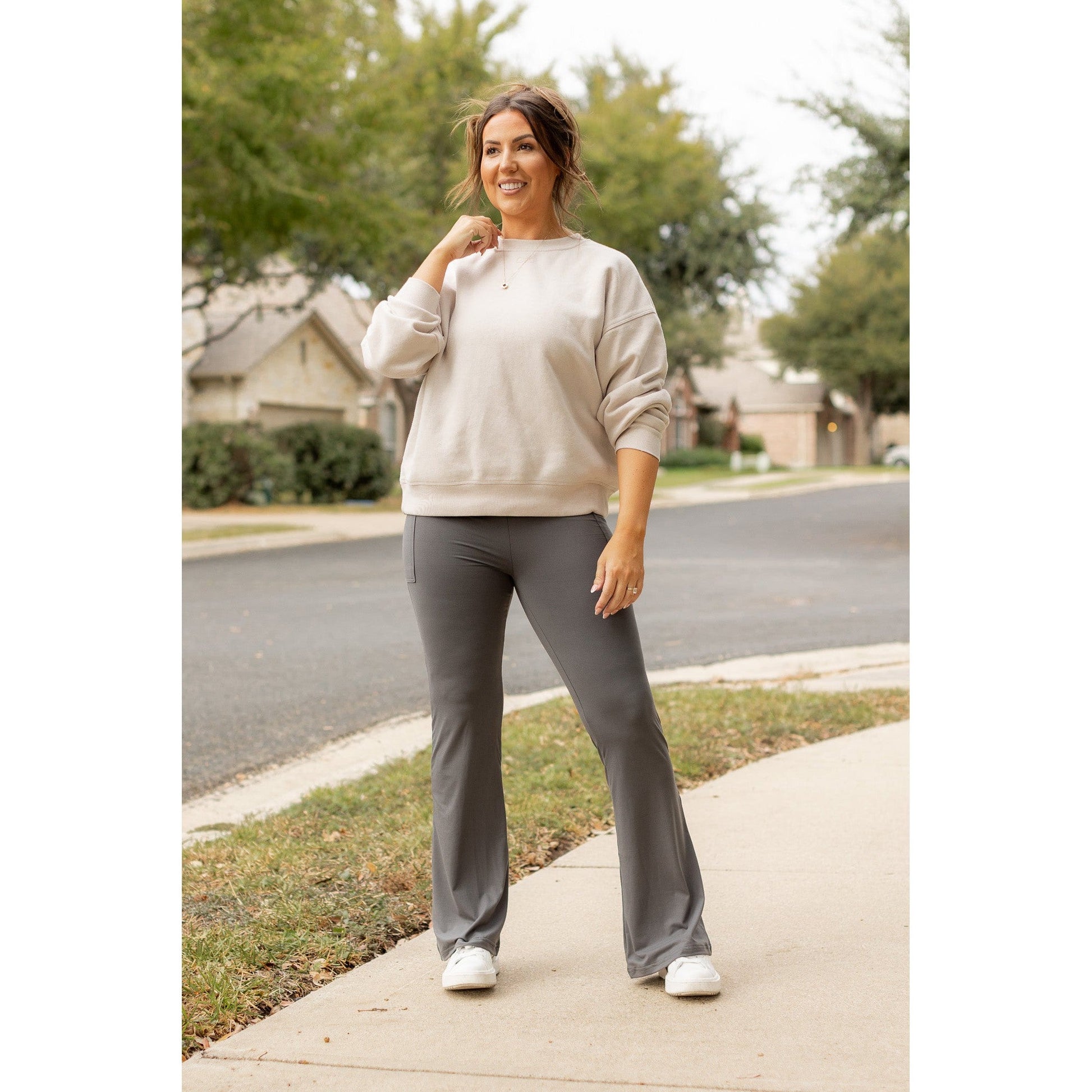 High-waisted charcoal bootcut leggings with pockets by Julia Rose, Julia Rose women’s charcoal flared leggings lifestyle image