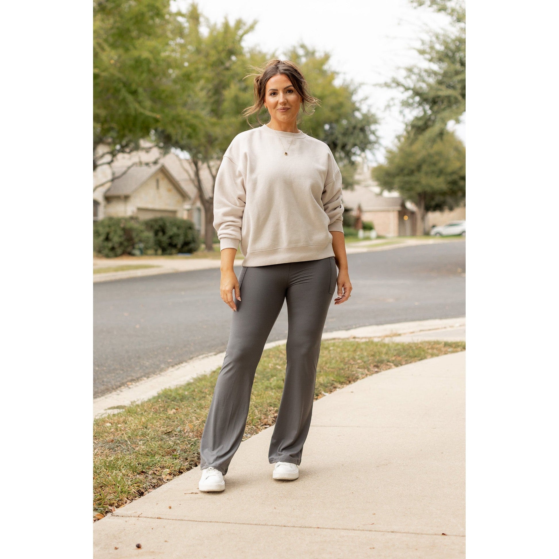 High-waisted charcoal bootcut leggings with pockets by Julia Rose, Julia Rose women’s charcoal flared leggings lifestyle image