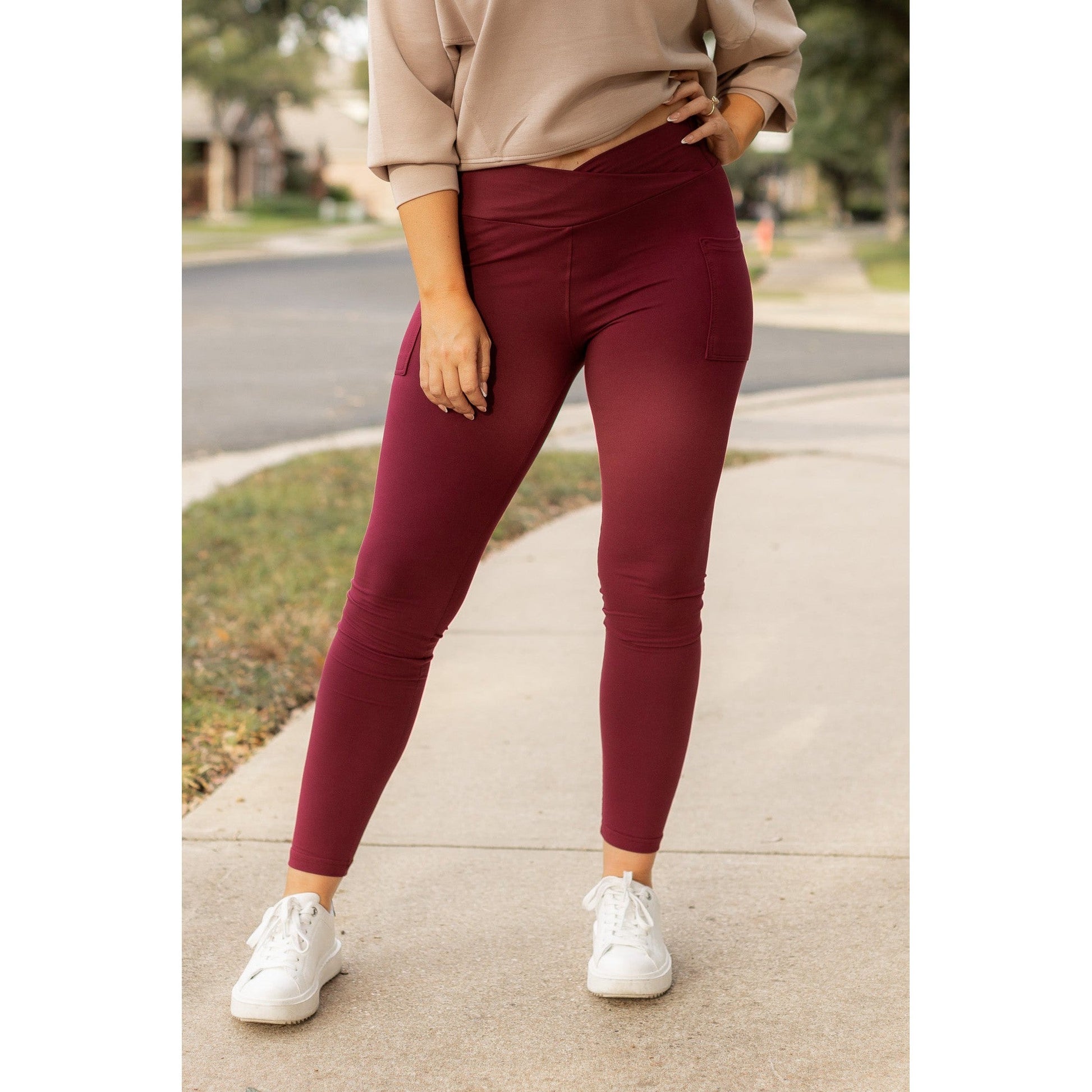 High-waisted maroon crossover leggings with pockets by Julia Rose, Julia Rose women’s maroon full length leggings lifestyle image