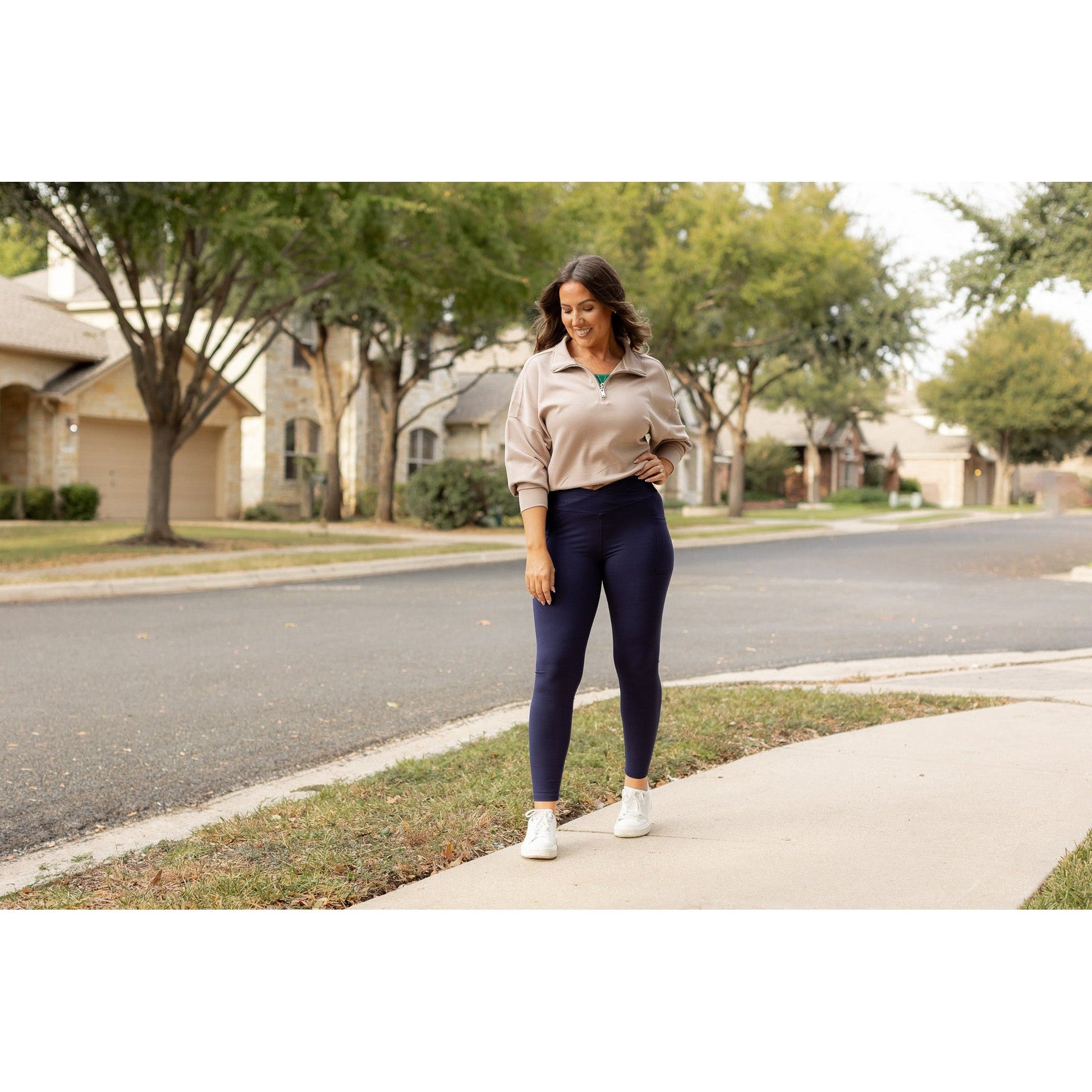 High-waisted navy crossover leggings with pockets by Julia Rose, Julia Rose women’s navy full length leggings lifestyle image