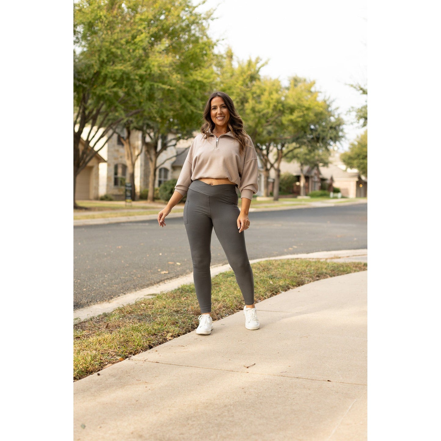 High-waisted charcoal crossover leggings with pockets by Julia Rose, Julia Rose women’s charcoal full length leggings lifestyle image