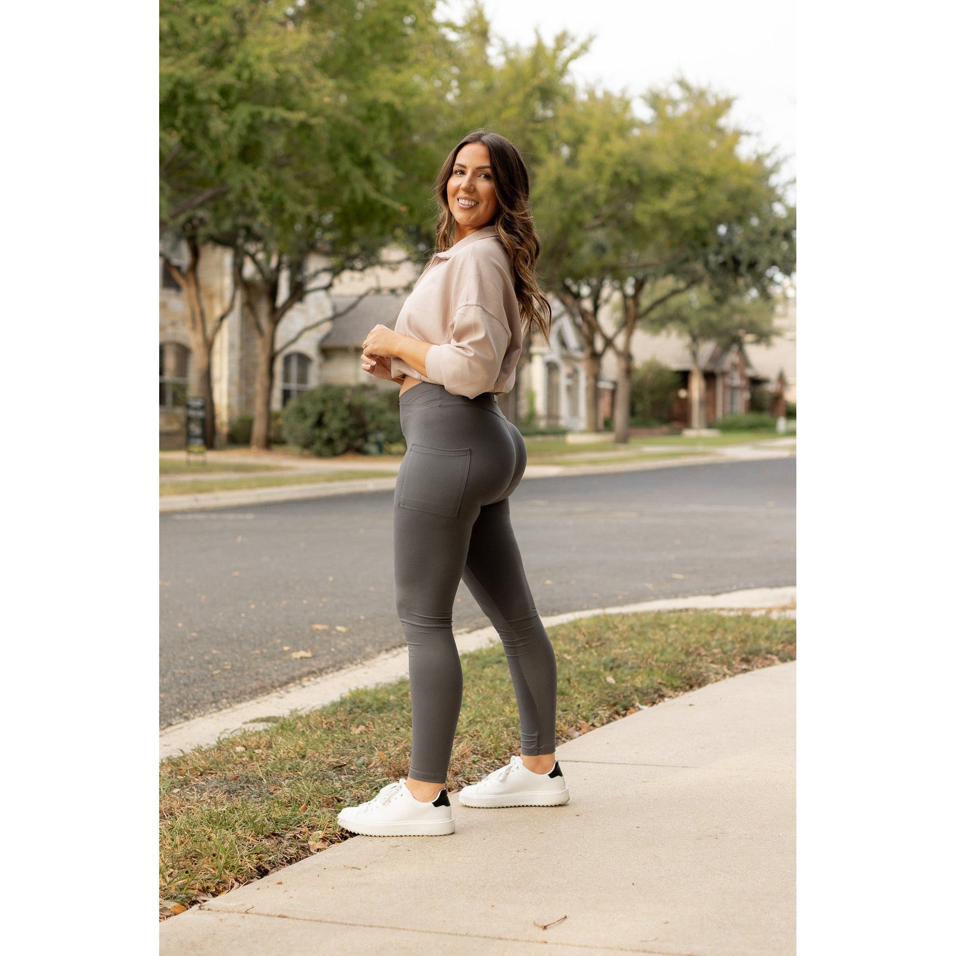 High-waisted charcoal crossover leggings with pockets by Julia Rose, Julia Rose women’s charcoal full length leggings lifestyle image