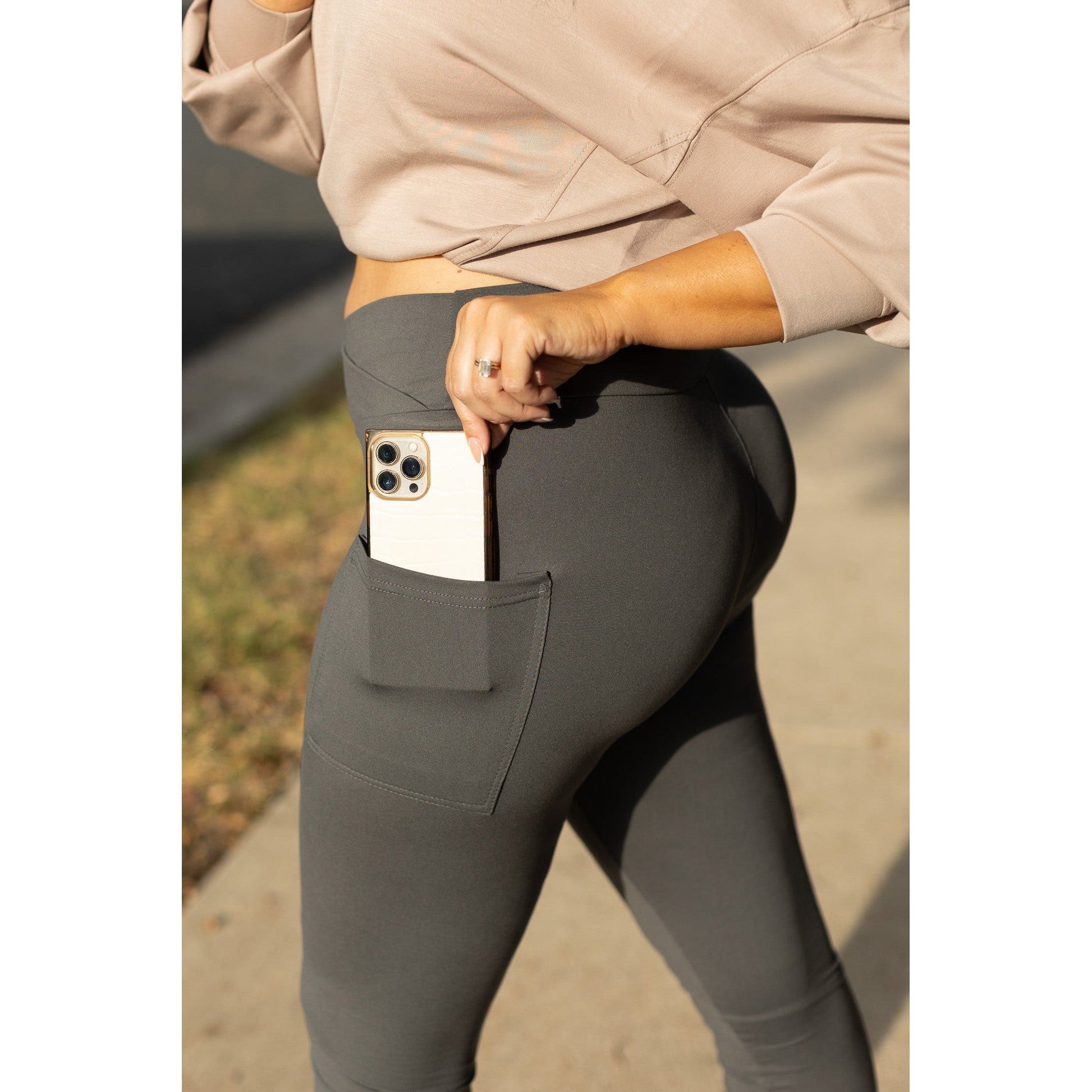 High-waisted charcoal crossover leggings with pockets by Julia Rose, Julia Rose women’s charcoal full length leggings lifestyle image
