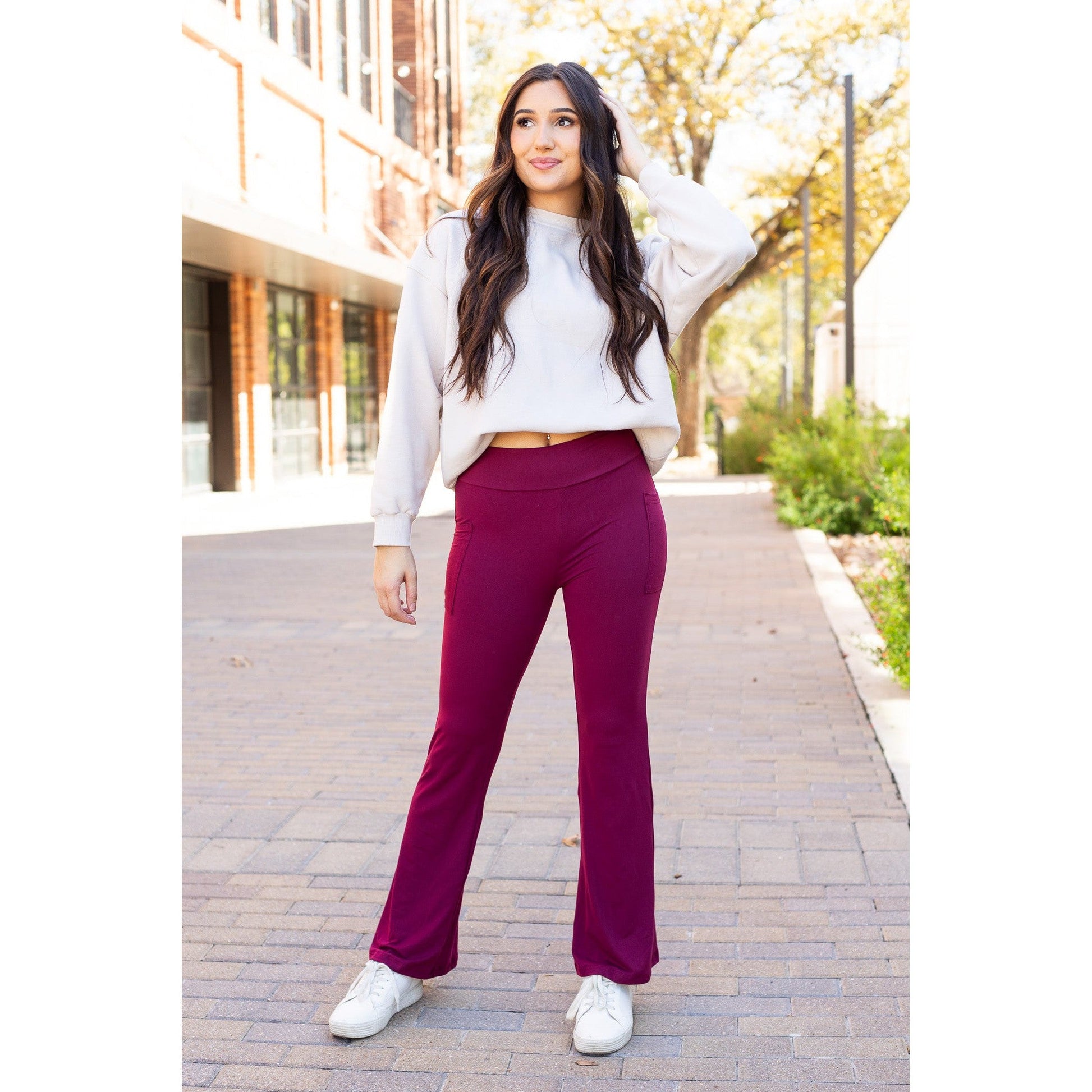 High-waisted maroon bootcut leggings with pockets by Julia Rose, Julia Rose women’s maroon flared leggings lifestyle image