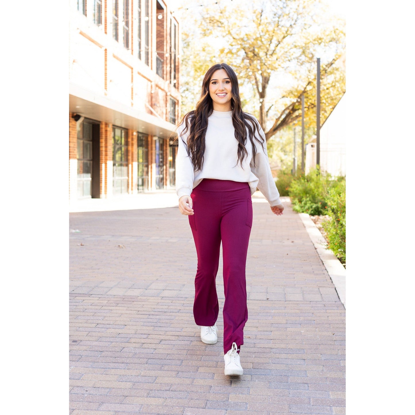 High-waisted maroon bootcut leggings with pockets by Julia Rose, Julia Rose women’s maroon flared leggings lifestyle image