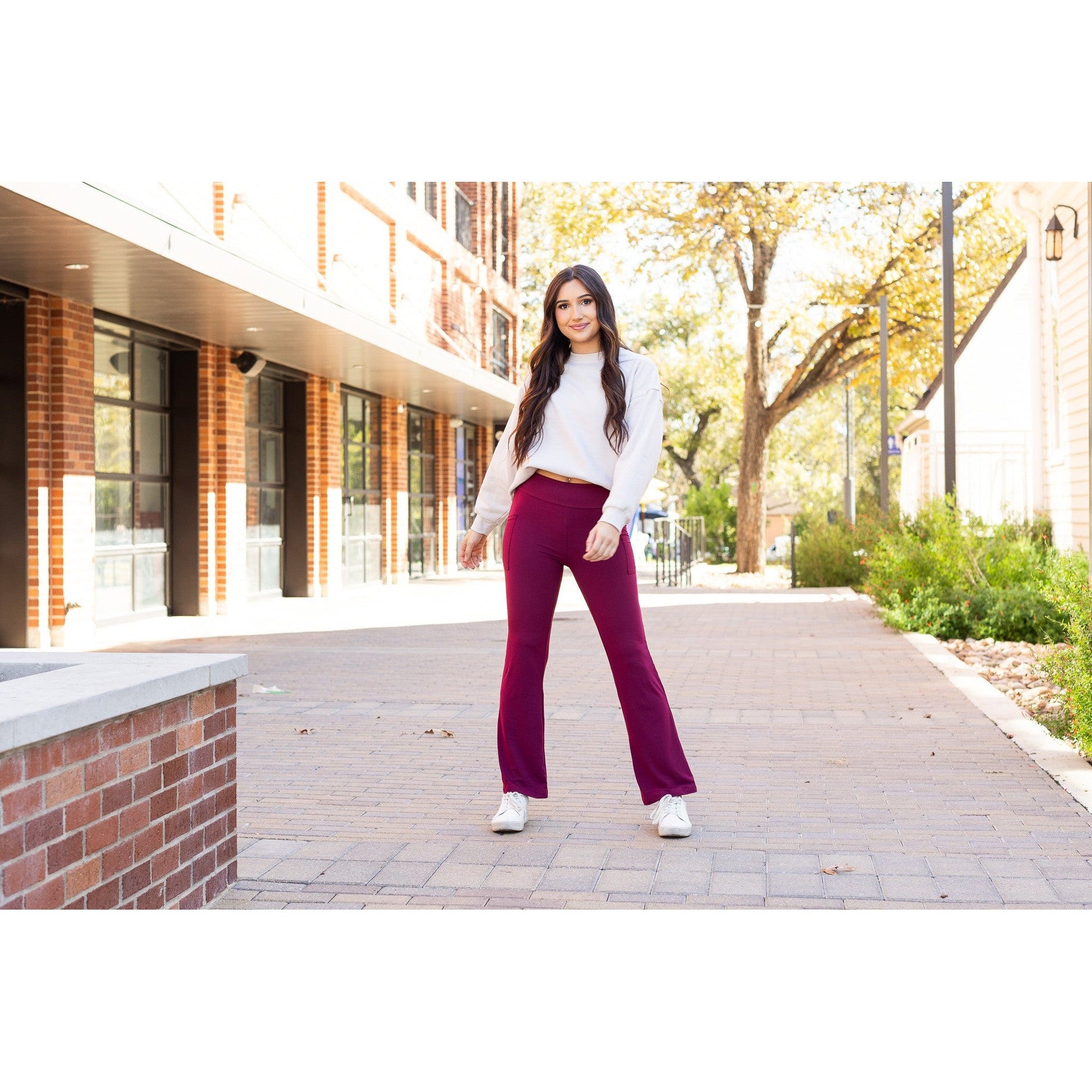 High-waisted maroon bootcut leggings with pockets by Julia Rose, Julia Rose women’s maroon flared leggings lifestyle image