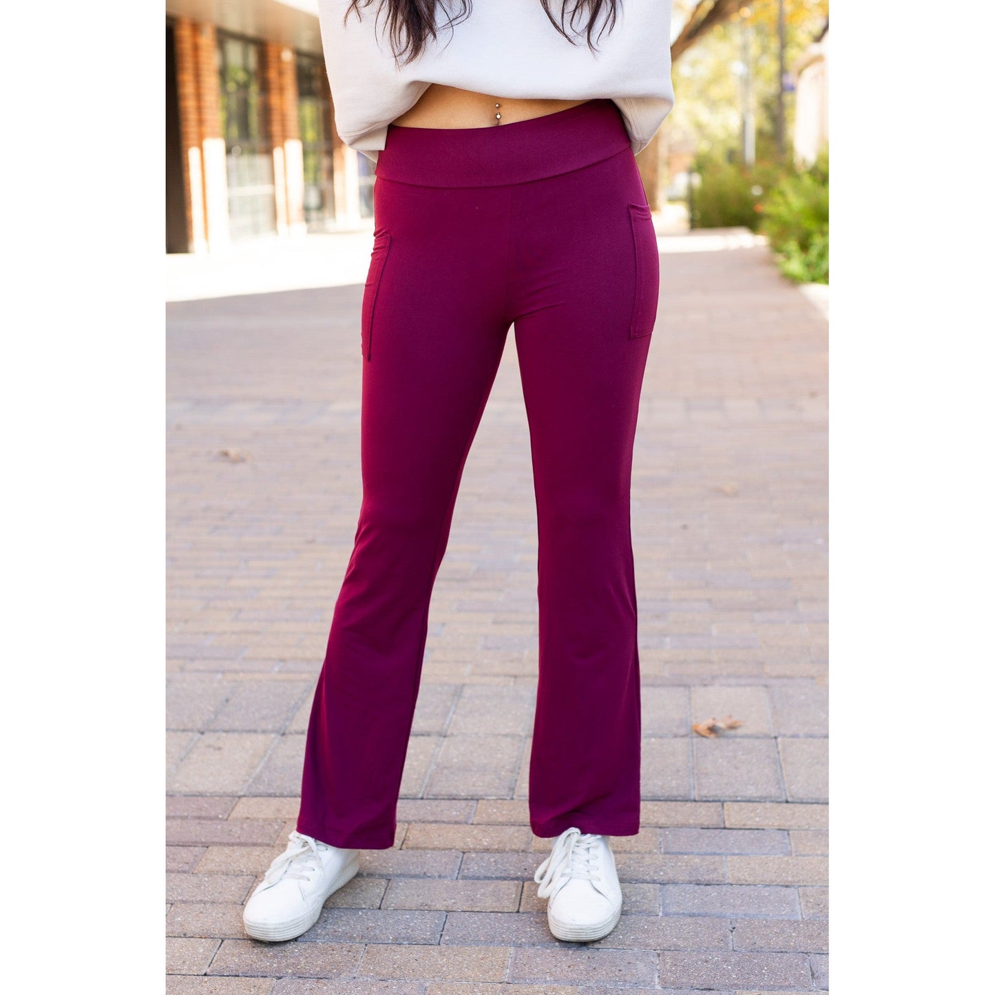High-waisted maroon bootcut leggings with pockets by Julia Rose, Julia Rose women’s maroon flared leggings lifestyle image