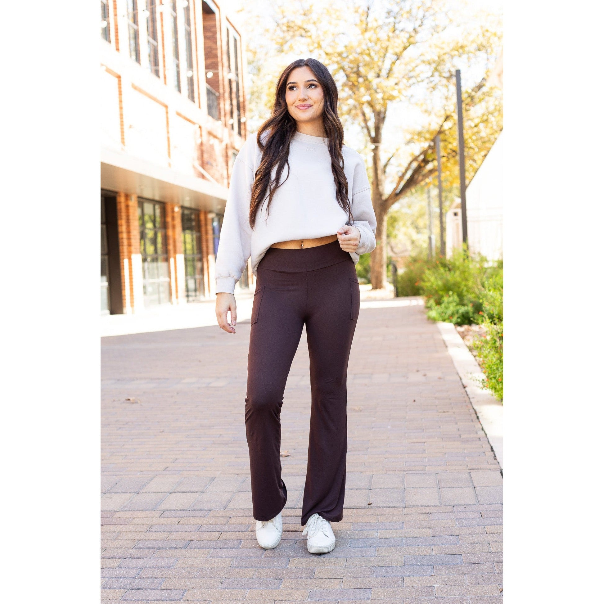 High-waisted brown bootcut leggings with pockets by Julia Rose, Julia Rose women’s brown flared leggings lifestyle image