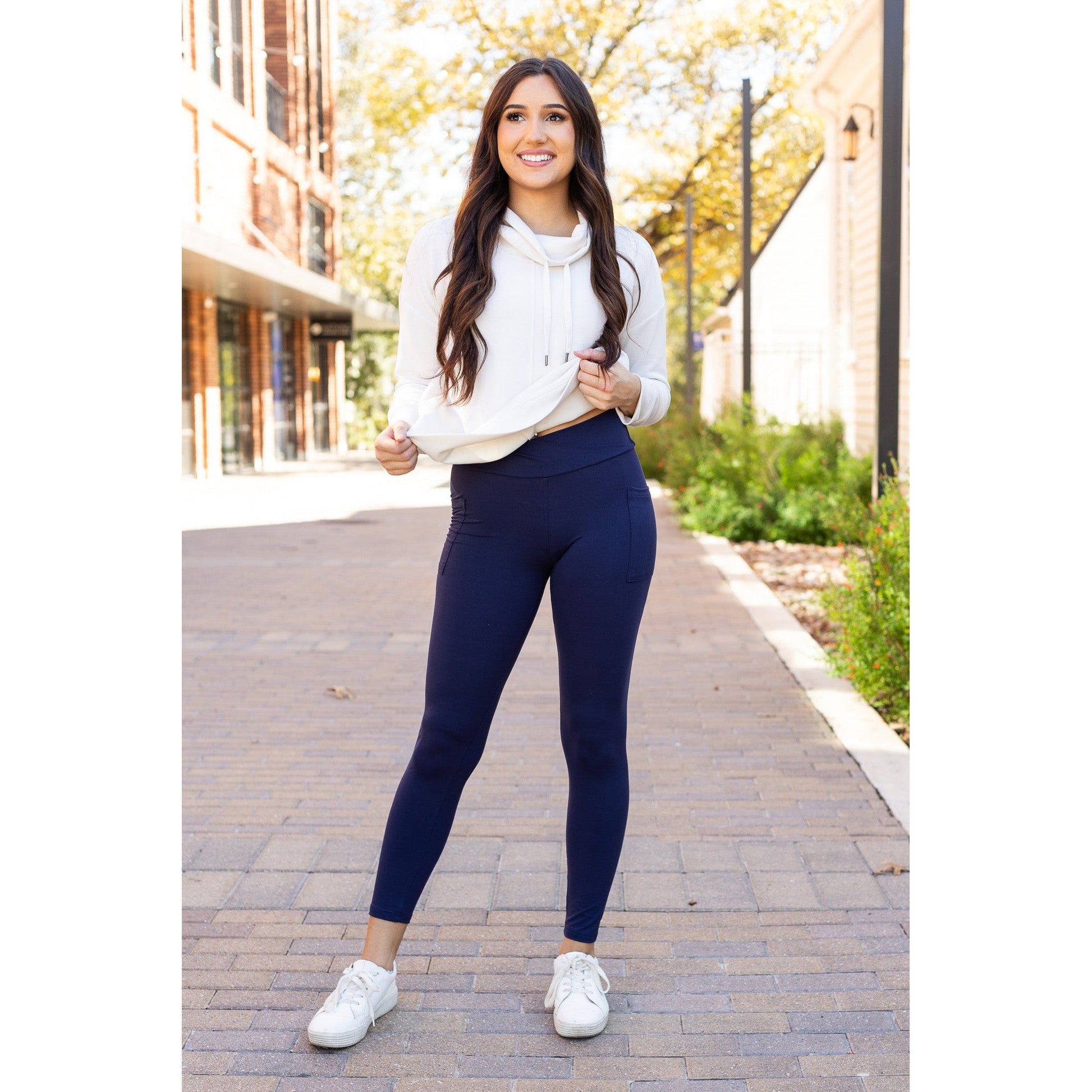 High-waisted navy crossover leggings with pockets by Julia Rose, Julia Rose women’s navy full length leggings lifestyle image