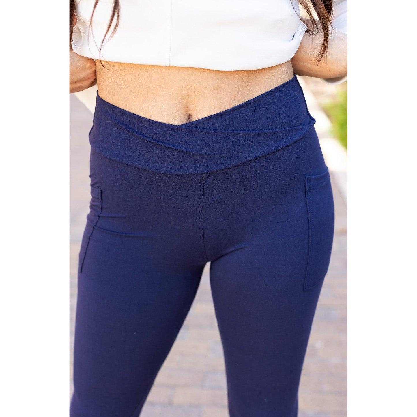 High-waisted navy crossover leggings with pockets by Julia Rose, Julia Rose women’s navy full length leggings lifestyle image