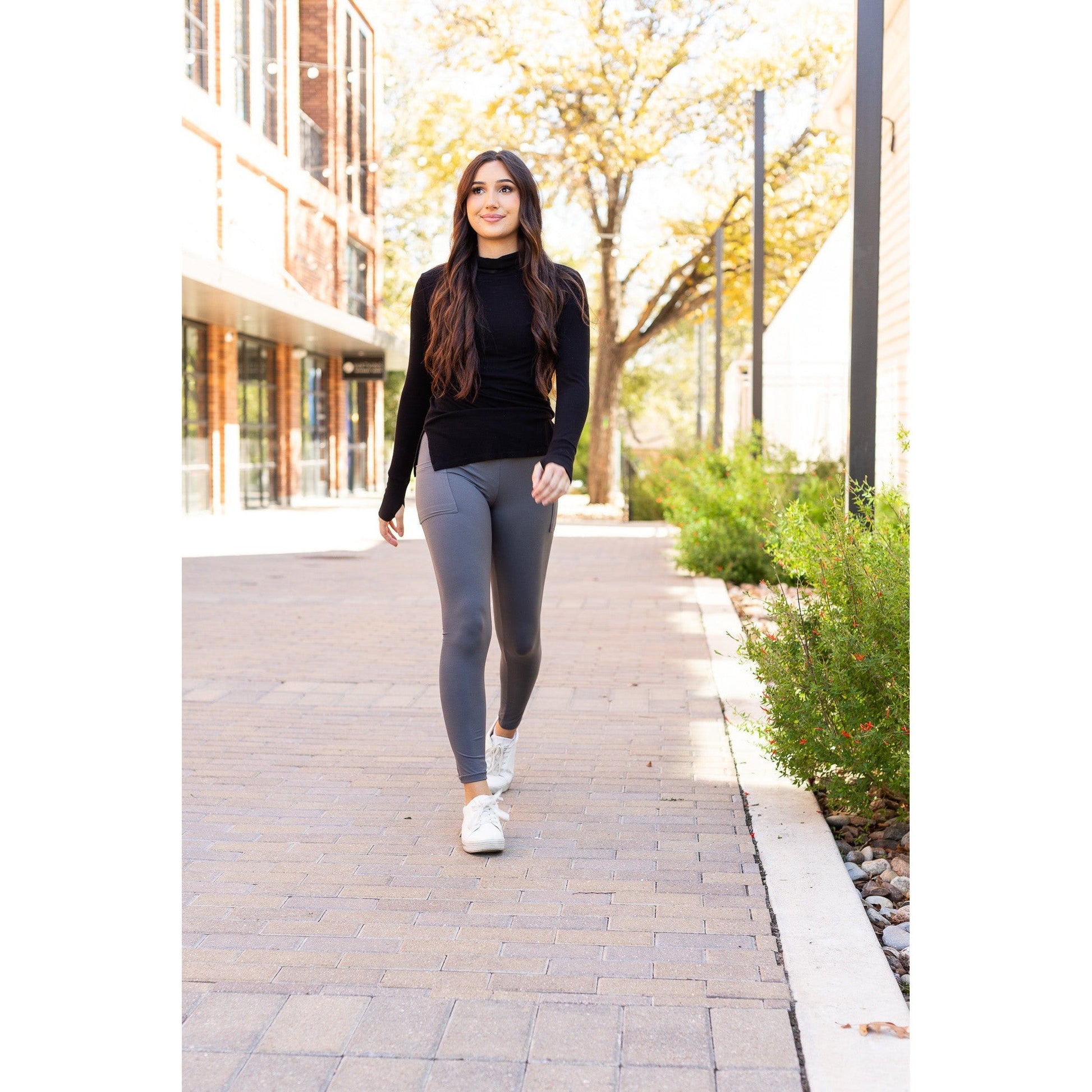 High-waisted charcoal crossover leggings with pockets by Julia Rose, Julia Rose women’s charcoal full length leggings lifestyle image