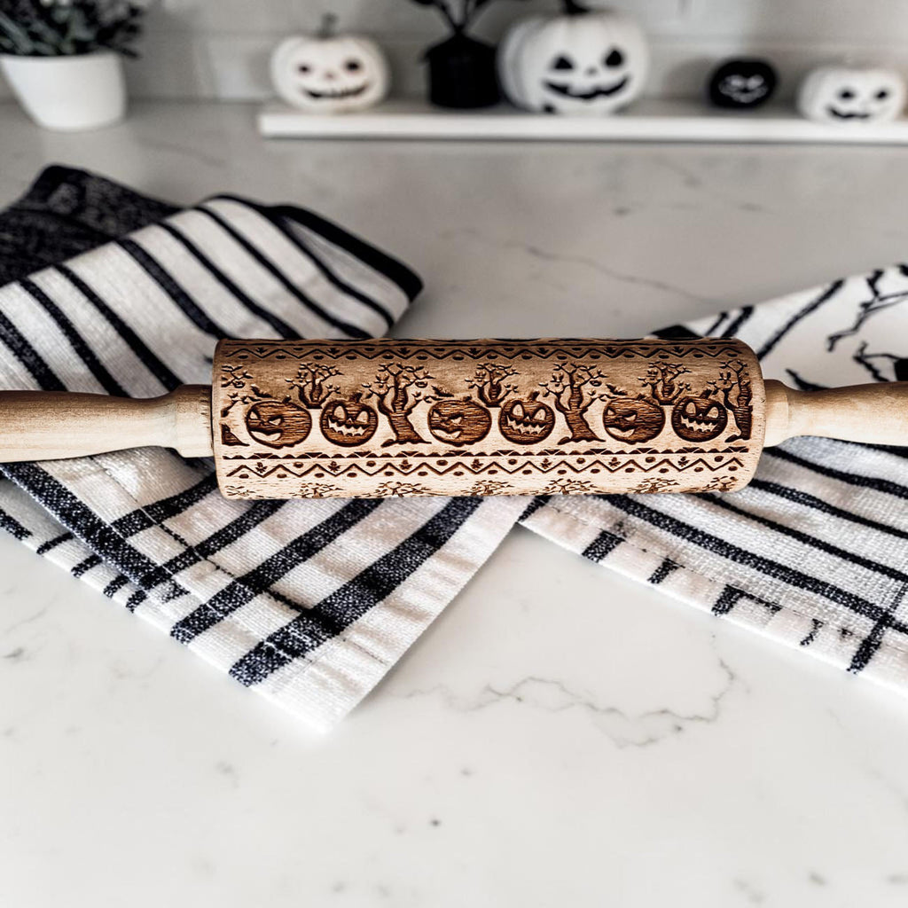 pumpkin pattern rolling pin for pie crust
Halloween baking tools wooden rolling pin
embossed rolling pin for sugar cookies Halloween
fall themed rolling pin with pumpkins and trees
Halloween cookie stamp rolling pin wood