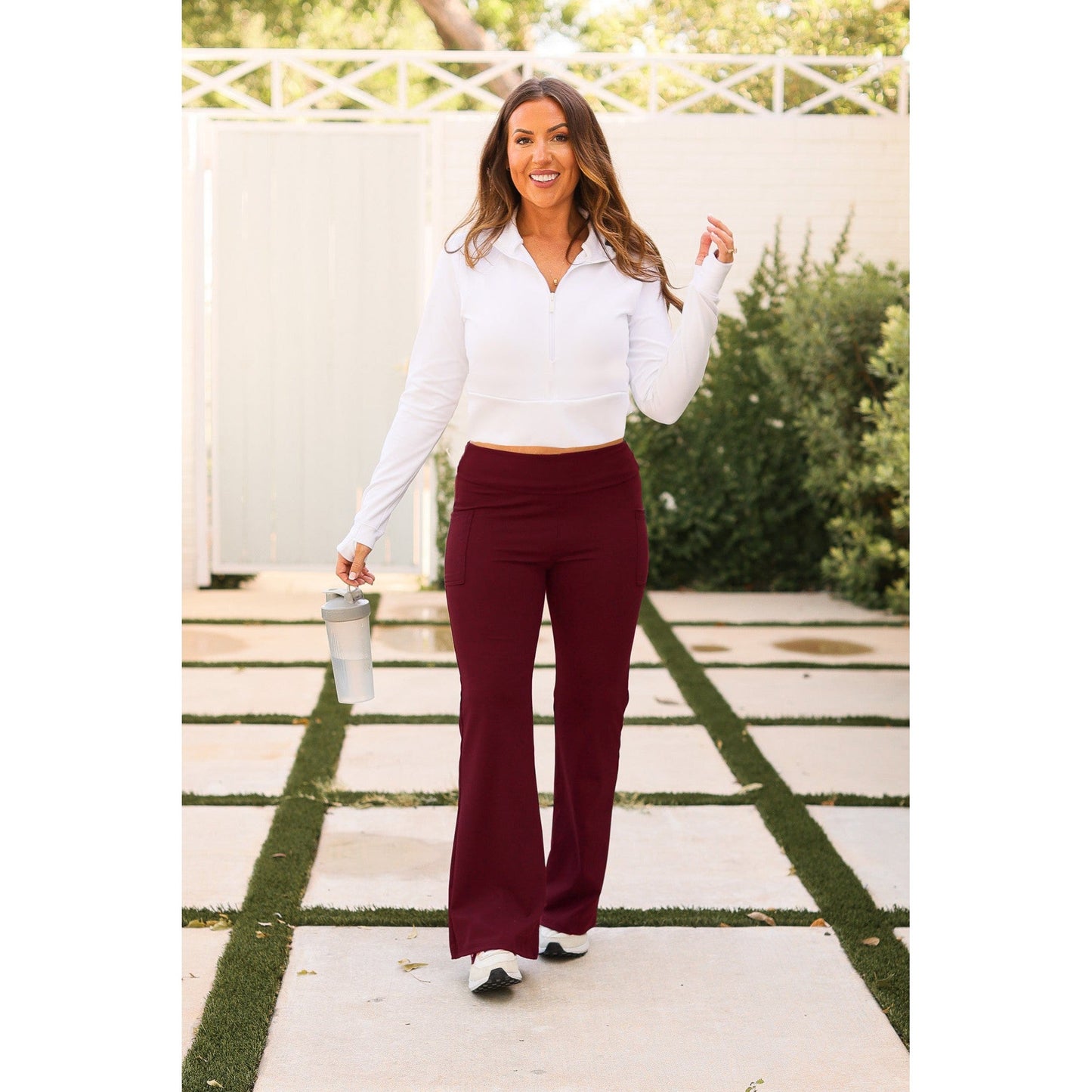 High-waisted maroon bootcut leggings with pockets by Julia Rose, Julia Rose women’s maroon flared leggings lifestyle image