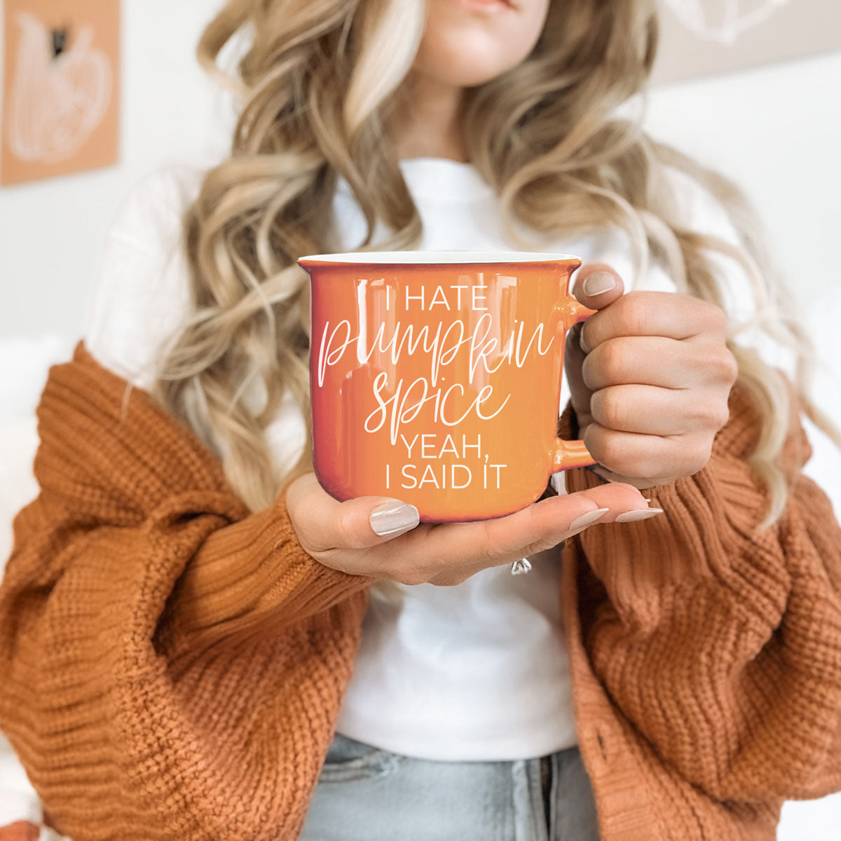 funny halloween mug for people who hate pumpkin spice
orange fall mug with bold white lettering
funny fall coffee cup on cozy table setup