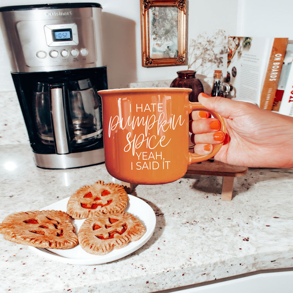non pumpkin spice fall coffee mug
funny autumn drinkware for coffee lovers
orange mug for fall decor and halloween season
sarcastic fall coffee mug for women
funny seasonal mug with minimalist fall styling
orange mug with fall candle and mini pumpkins
cozy living room setup with sarcastic fall mug
autumn breakfast table with coffee and orange mug