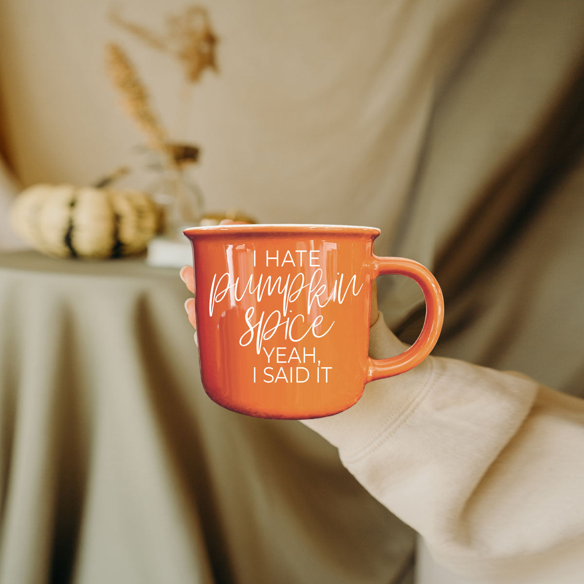 bright orange autumn mug with rustic wood backdrop
funny fall mug styled with neutral home decor
orange ceramic mug with fall foliage and acorns
autumn coffee mug for realistic fall lovers