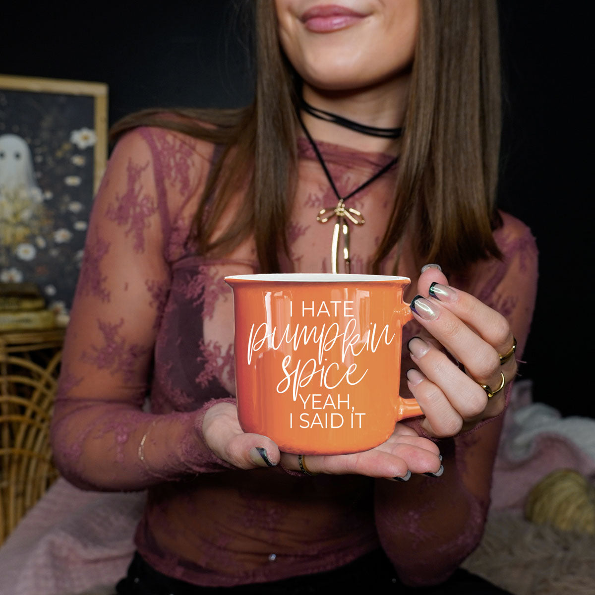 funny seasonal mug with minimalist fall styling
orange mug with fall candle and mini pumpkins
cozy living room setup with sarcastic fall mug