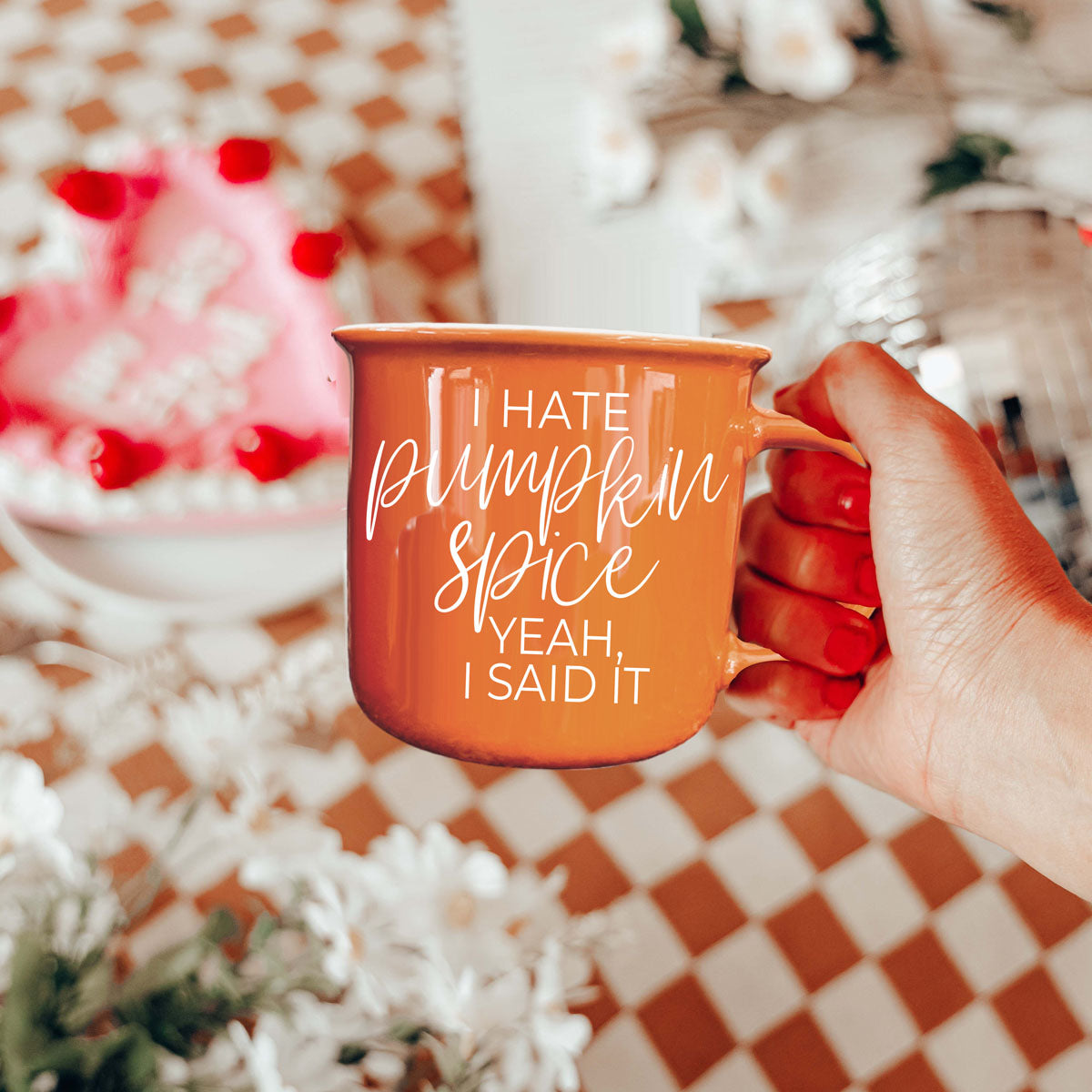orange ceramic mug against rustic shiplap wall
fall themed hot drink station featuring orange mug
funny orange coffee cup on woven rattan tray